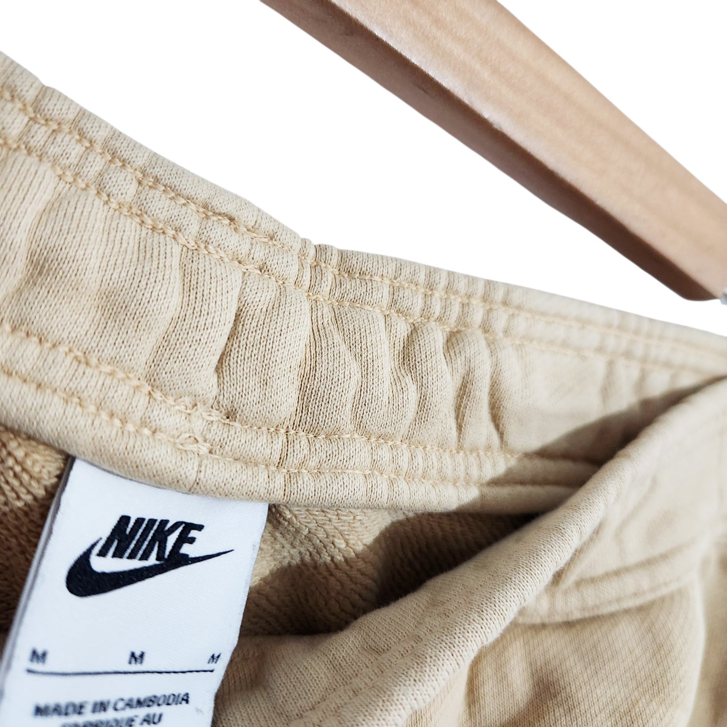 NIKE AIR | מכנסי טרנינג לגבר | מידה M | בז' | קרע מתוקן