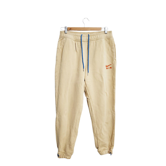 NIKE AIR | מכנסי טרנינג לגבר | מידה M | בז' | קרע מתוקן
